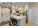 Bright kitchen featuring stainless steel appliances and a breakfast bar at 4110 Central Sarasota Pkwy # 123, Sarasota, FL 34238