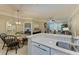 Kitchen with breakfast bar overlooking dining area, bedroom and living room at 4110 Central Sarasota Pkwy # 123, Sarasota, FL 34238