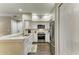 Updated kitchen featuring stainless appliances, granite countertops, and dark wood flooring at 4110 Central Sarasota Pkwy # 123, Sarasota, FL 34238