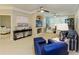 Spacious living room showcasing coastal style decor and ample natural light at 4110 Central Sarasota Pkwy # 123, Sarasota, FL 34238