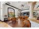 Spacious lounge area with beautiful hardwood flooring, wet bar, and comfortable seating at 4110 Central Sarasota Pkwy # 123, Sarasota, FL 34238