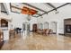 Large lobby with travertine floors, seating areas, and a grand piano at 4110 Central Sarasota Pkwy # 123, Sarasota, FL 34238