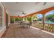 Covered outdoor patio with comfortable seating overlooking the pool, creating a perfect space for relaxation and socializing at 4110 Central Sarasota Pkwy # 123, Sarasota, FL 34238