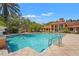 Relaxing pool area with lush tropical foliage, providing a tranquil and inviting space for recreation at 4110 Central Sarasota Pkwy # 123, Sarasota, FL 34238