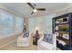 Cozy sitting area with bright windows, plantation shutters and comfortable chairs at 4110 Central Sarasota Pkwy # 123, Sarasota, FL 34238