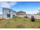 Wide backyard with patio, lawn and privacy fence at 4231 Autumn Fog Ct, Palmetto, FL 34221
