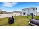 Large backyard with patio, lawn and privacy fence at 4231 Autumn Fog Ct, Palmetto, FL 34221