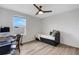 Bedroom features modern ceiling fan, window, and desk space at 4231 Autumn Fog Ct, Palmetto, FL 34221