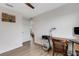 Bright bedroom boasts wood floors, white walls, a ceiling fan and workspace at 4231 Autumn Fog Ct, Palmetto, FL 34221