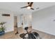 Bonus Room with an exercise machine, ceiling fan, mirror and a view to the bathroom and bedroom at 4231 Autumn Fog Ct, Palmetto, FL 34221
