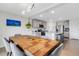 Dining room with a kitchen view, features modern lighting, and ample seating at 4231 Autumn Fog Ct, Palmetto, FL 34221