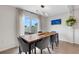 Dining area bathed in natural light with modern fixtures and a view of the serene outdoors at 4231 Autumn Fog Ct, Palmetto, FL 34221