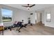 Spacious exercise room with ample natural light, modern ceiling fan, and an indoor rowing machine at 4231 Autumn Fog Ct, Palmetto, FL 34221