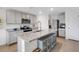 Bright kitchen featuring stainless steel appliances, granite countertops, and a large central island with storage at 4231 Autumn Fog Ct, Palmetto, FL 34221