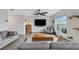 Bright living room with tile flooring, contemporary decor, and a large flat-screen TV for comfortable living at 4231 Autumn Fog Ct, Palmetto, FL 34221