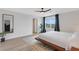Bright main bedroom featuring a ceiling fan, stylish rug, and plenty of natural light at 4231 Autumn Fog Ct, Palmetto, FL 34221