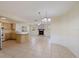 Spacious open-concept area combining kitchen, living and dining spaces with lots of natural light at 4296 Symco Ave, North Port, FL 34286