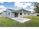 Exterior shot of home featuring a covered patio and sliding glass doors at 4493 Mckibben Dr, North Port, FL 34287