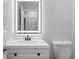 Close up view of the updated bathroom with new vanity and toilet at 4493 Mckibben Dr, North Port, FL 34287