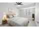 Inviting bedroom boasts minimalist decor, a ceiling fan, and natural lighting at 4493 Mckibben Dr, North Port, FL 34287