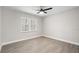 A bedroom with natural light from a large window at 4493 Mckibben Dr, North Port, FL 34287
