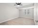 Well-lit bedroom features a ceiling fan, tile flooring, and a closet at 4493 Mckibben Dr, North Port, FL 34287
