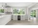 Cozy dining area featuring a bar, beverage cooler, and backyard view at 4493 Mckibben Dr, North Port, FL 34287