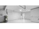 Spacious and freshly painted two car garage interior with ample storage and updated water heater at 4493 Mckibben Dr, North Port, FL 34287