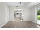 Bright and airy living room features hardwood flooring that leads into the open kitchen at 4493 Mckibben Dr, North Port, FL 34287