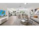 Open concept living space blending seamlessly into the modern kitchen and dining area, perfect for entertaining at 4493 Mckibben Dr, North Port, FL 34287
