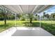 Covered patio in a large grassy backyard at 4493 Mckibben Dr, North Port, FL 34287