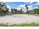 A sandy volleyball court offers recreational opportunities for residents in a community setting at 4493 Mckibben Dr, North Port, FL 34287