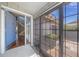 Welcoming entryway featuring decorative glass door, storm door, and an open staircase at 4543 Forest Wood Trl # 33, Sarasota, FL 34241