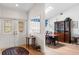 Bright dining room with hardwood floors, a skylight and classic furnishings and decor at 4701 Pine Harrier Dr, Sarasota, FL 34231