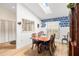 Bright dining room with hardwood floors, a skylight and classic furnishings and decor at 4701 Pine Harrier Dr, Sarasota, FL 34231