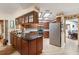 Traditional kitchen with stainless steel appliances, dark countertops and breakfast bar at 4701 Pine Harrier Dr, Sarasota, FL 34231