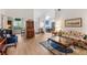 Open concept living room with hardwood floors and classic furnishings perfect for entertaining at 4701 Pine Harrier Dr, Sarasota, FL 34231