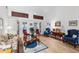 Bright living room with wood floors, high ceilings, and large French doors for natural light at 4701 Pine Harrier Dr, Sarasota, FL 34231