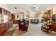 Living room area next to kitchen with brick fireplace and open floor plan at 4701 Pine Harrier Dr, Sarasota, FL 34231
