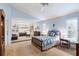 Main bedroom featuring carpet floors, built-in shelving and blue walls and accent at 4701 Pine Harrier Dr, Sarasota, FL 34231
