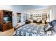 Spacious main bedroom with built-in shelving, carpet floors and view of outdoor area at 4701 Pine Harrier Dr, Sarasota, FL 34231