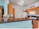 Kitchen bar overlooking appliances and wood cabinetry, perfect for casual dining and meal preparation at 4802 51St W St # 1714, Bradenton, FL 34210