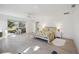 Bright bedroom featuring sliding doors leading to a patio and a king size bed at 4965 Marsh Field Rd, Sarasota, FL 34235