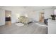 Open bedroom with light floors, natural light, a king size bed, and ample space at 4965 Marsh Field Rd, Sarasota, FL 34235