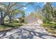 Inviting single-story home with a brick driveway and well-maintained landscaping, offering great curb appeal at 4965 Marsh Field Rd, Sarasota, FL 34235