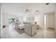 Airy living area featuring dining table, comfortable sofa, and ample natural light at 4965 Marsh Field Rd, Sarasota, FL 34235