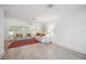 Spacious living room with two sofas and a large red patterned rug at 4965 Marsh Field Rd, Sarasota, FL 34235