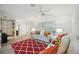 Open living room with bright natural light and modern decor with sleek floors at 4965 Marsh Field Rd, Sarasota, FL 34235