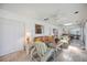 Bright sunroom with tile floor, wicker furniture, ceiling fan, and view of pool at 4965 Marsh Field Rd, Sarasota, FL 34235