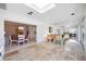 Beautiful sunroom with tile floors leads to dining and living areas at 4965 Marsh Field Rd, Sarasota, FL 34235